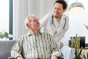 Nurse providing compassionate care to elderly veteran in hospice setting, emphasizing comfort and support for end-of-life care in Austin.